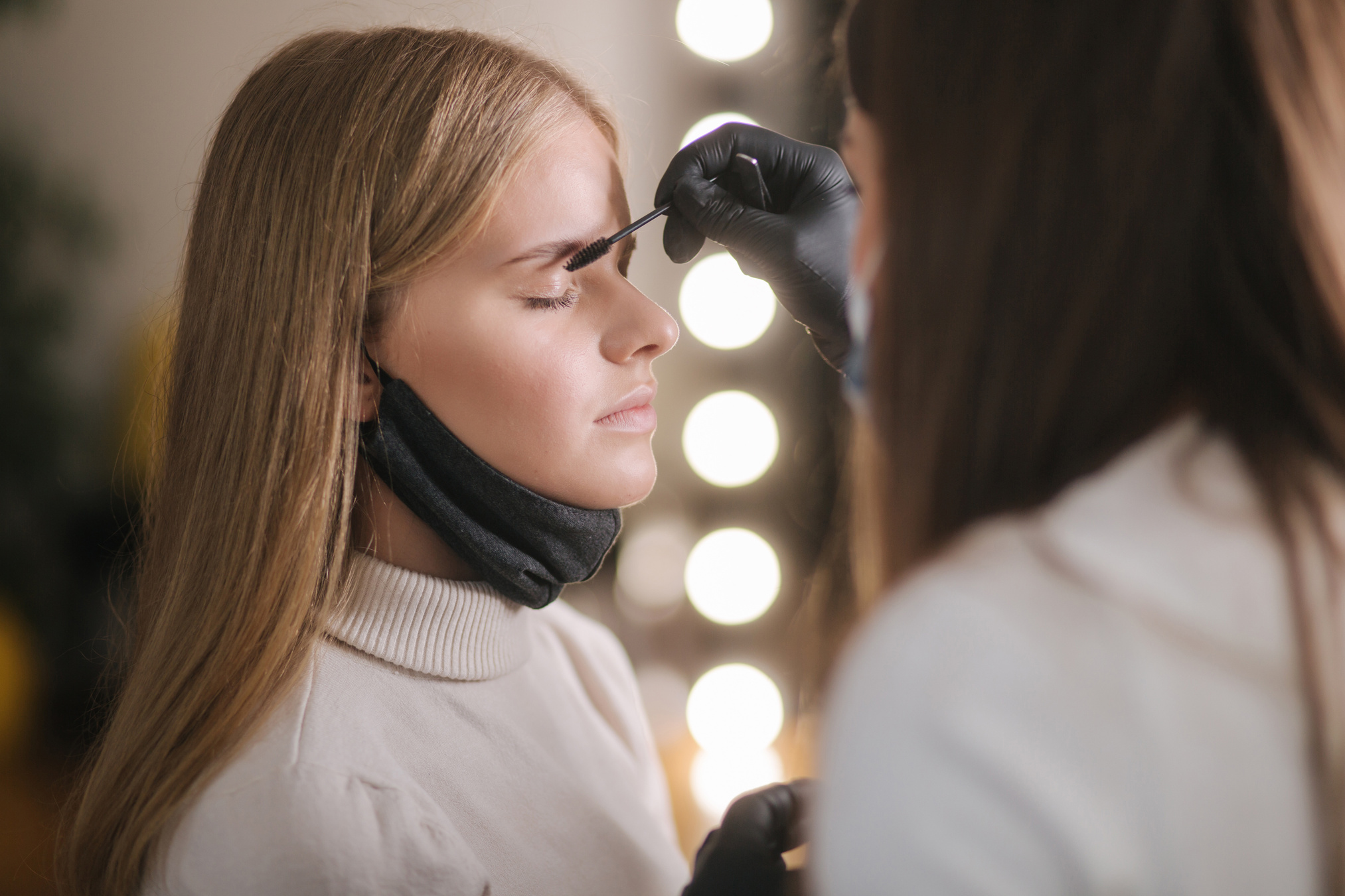 Brow and Makeup Artist in Protective Mask 